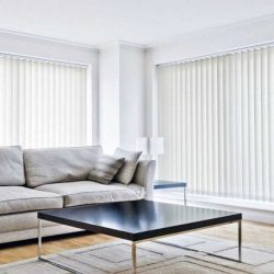 white-vertical-blinds-in-living-room-with-grey-sofa-and-chocolate-brown-coffee-table